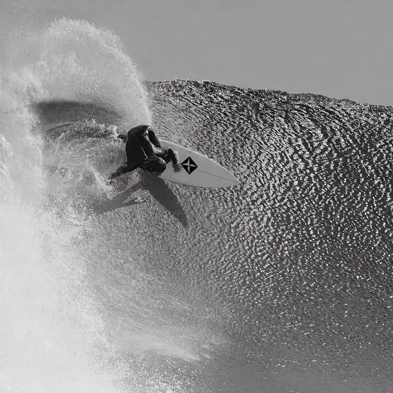 Surfer carving through a wave